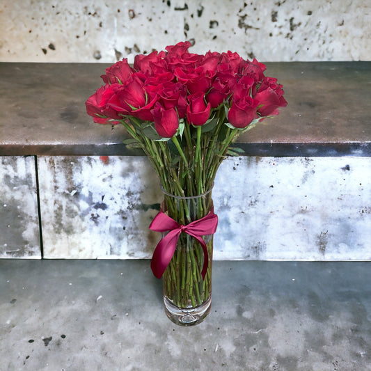 50 Stem Red Roses with a Clear Illusion Vase